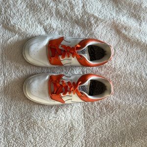 Orange and white Nike Zoom Air